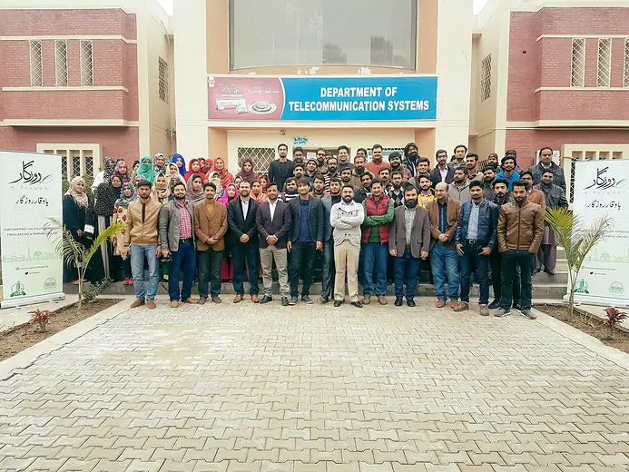 Large group photo at an e-Rozgaar training outside a university department