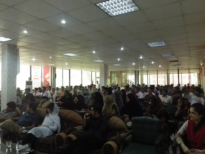 Audience seated in a large hall
