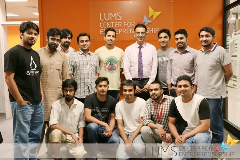 Group photo in front of the LUMS Centre for Entrepreneurship wall