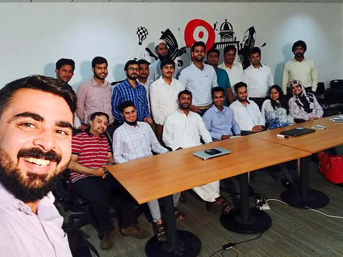 Selfie with a group around a conference table