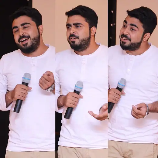 Three frames of a speaker talking with a microphone