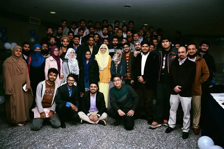 Large group photo of students at an indoor event