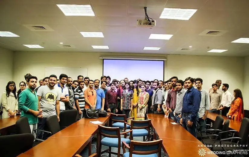 Large group photo in a training room
